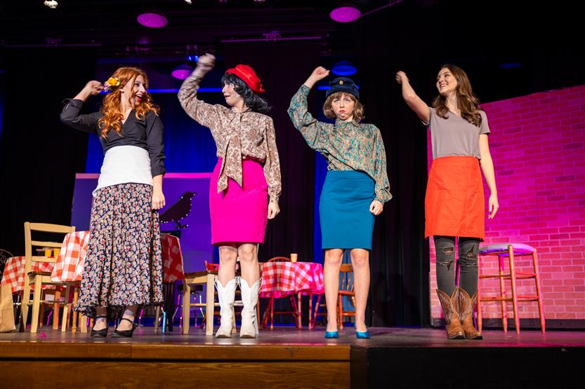Students perform onstage